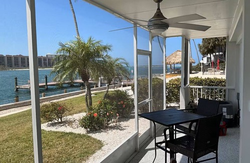 Isles of Capri Apartment | Paradise on the Isles - Stunning Waterfront Views - Pool & Dock Steps Away