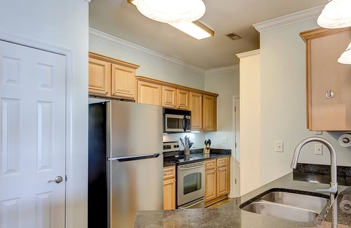 Charleston Condo | Peaceful condo with pool, W/D, balcony, TV, deck, & kitchen - close to beach