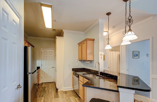 Charleston Condo | Peaceful condo with pool, W/D, balcony, TV, deck, & kitchen - close to beach