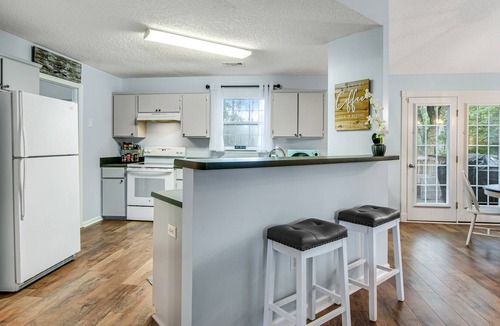 Midway House | Peaceful lake escape with water views, outdoor games, firepit, & on-site fishing