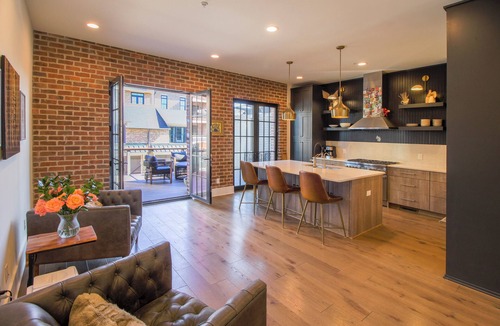 Hitch Village - Fred Wessels Homes House | Riverside Loft – Luxury Living Steps from Riverfront by Lucky Savannah