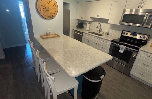 Harbor Heights Condo | Rocket View & 5 minute Walk to the Beach - Immaculate, Remodeled Condo with Pool