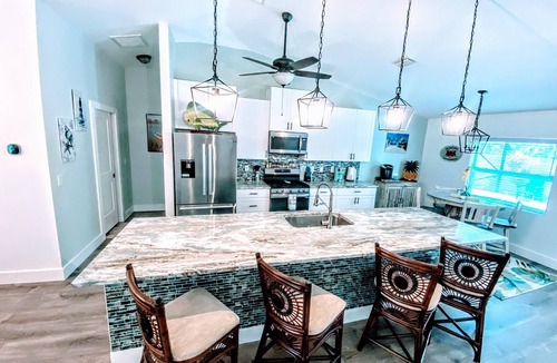 Vero Beach House | Romantic getaway! Pool home with hot tub ,Tiki Bar. Close Beaches , live music !