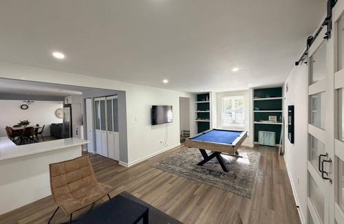 Charlotte House | Room for everyone in this spacious 5-bedroom retreat! Gather, relax, and unwind with a luxurious king suite, a fun pool table, and fast Wi-Fi — perfect for family reunions and group getaways alike.