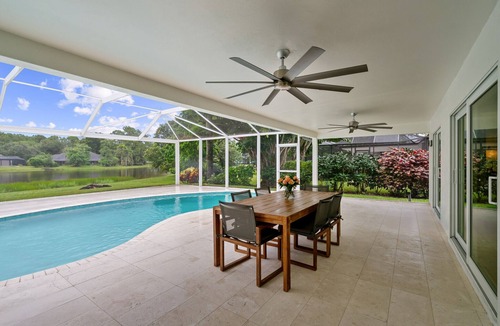 Kings Lake House | Rovigo Vacation Rental: Spacious Retreat with Panoramic Lake Views in Kings Lake. 4-BR, 4-Bathroom Home with Private Pool, just 3.4 Miles from the Vibrant Fifth Avenue South and Naples Attractions