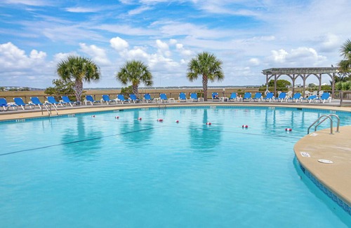 Oceanmarsh Subdivision Condo | Sandy Toes: Harbor Isl Pool & Beach Retreat