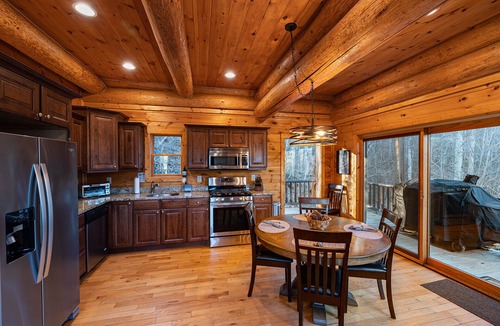 Almond Cabin | Secluded log cabin with fireplace and hot tub on deck.