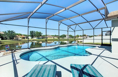 Crescent Lakes House | Smiling Disney Oasis heated pool home in Kissimmee with Game room.