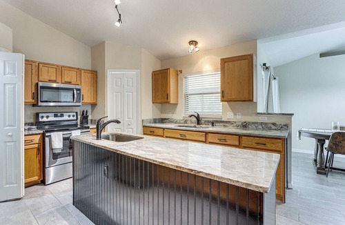 Deltona Lakes House | Spacious 4BR Home in Deltona w/Screened Porch!
