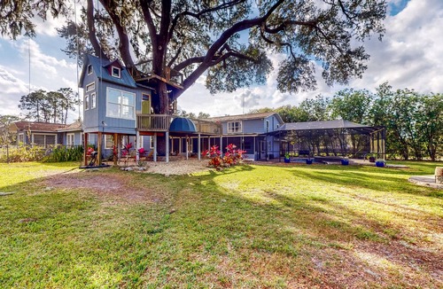 Plant City House | Spacious Designer Home with Private Solar-Heated Pool, Treehouse & Sunroom