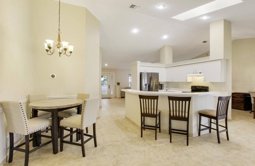 Fort Pierce House | The golden palm by the river