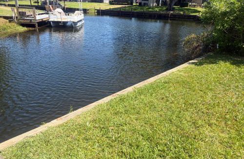 Highland House | The Perfect Getaway Canal front 2-bedroom home with lake access, in Lake Placid FL