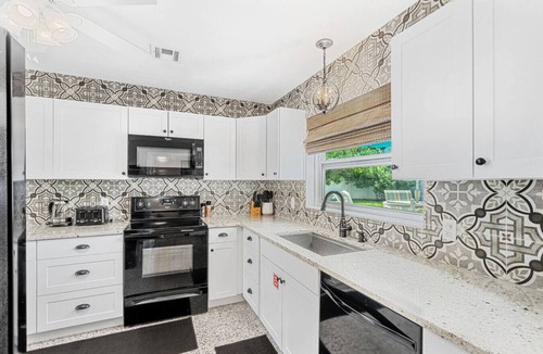 Cocoa Beach House | TIKI BLUE TWO: Family-sized beach house. Walk to Beach. Heated Pool & Hot Tub.