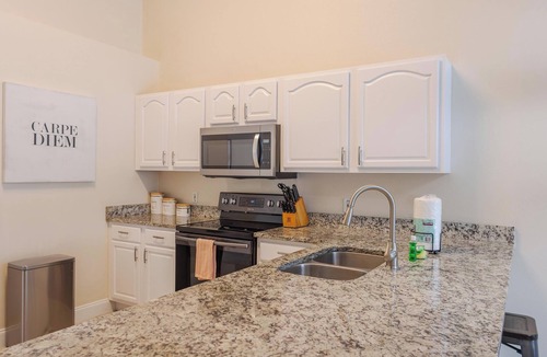 Lake Berkley Villa | Tropical Boho Lakefront Villa | Private Pool & Spa | Game Room | Near Disney