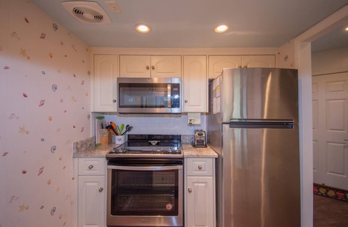 Saint Helena Island Condo | Two-Story Condo with Private Deck, WiFi, & Courtyard Pool Access