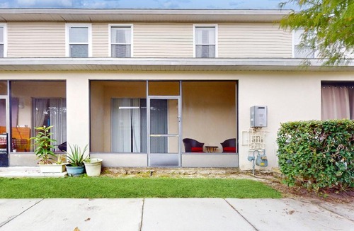 Trafalgar Village House | Updated retreat with pool access, W/D, AC, & patio - close to Disney Parks