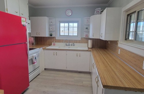 Cedar Point Apartment | Waterfront with private dock, Hot tub, & swim mat. Large fenced backyard and screened in porch for relaxing.