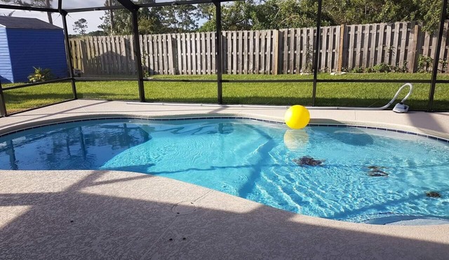 Cozy Port St Lucie getaway. Lanai Plus Private Heated Pool & Private Gardens