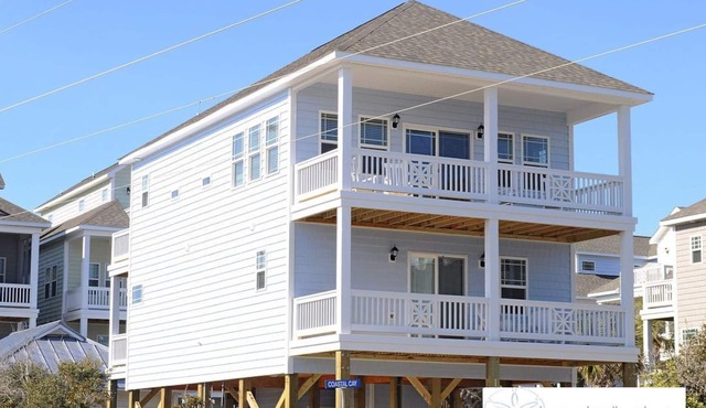 Escape to great views of the ocean & sound in this sun soaked reverse plan home