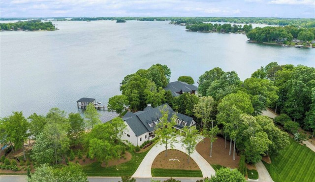 Exquisite New build on LN with over 295 ft of water frontage on a private street