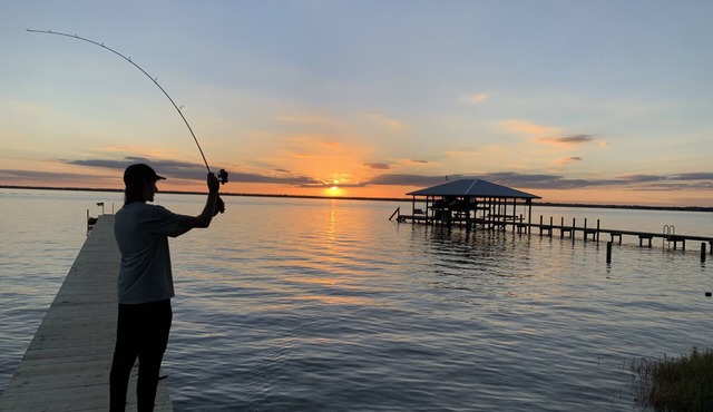 Lakefront getaway with white sand, clear water, gorgeous sunsets