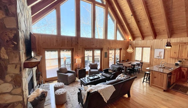 Lakefront house with multiple outdoor areas, fire pit, dock and two kayaks