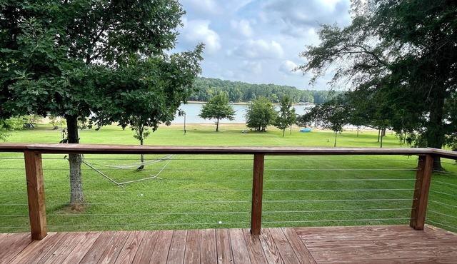 Light & Airy Lakefront Home with Flat Yard, Private Dock, Deck & Screened Porch