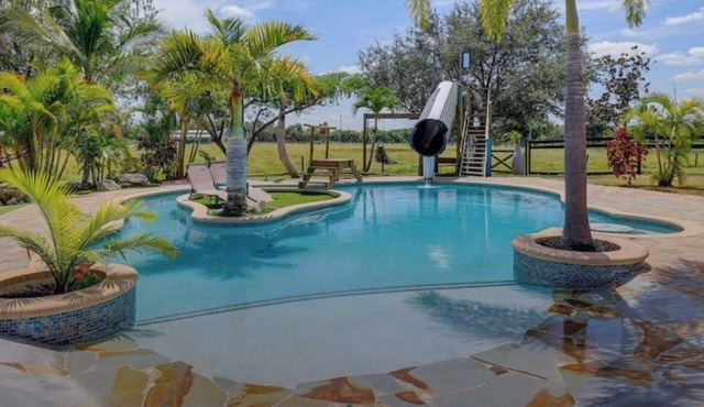 Private Tropical Oasis 4/2 Home with Resort Style Pool & Waterslide