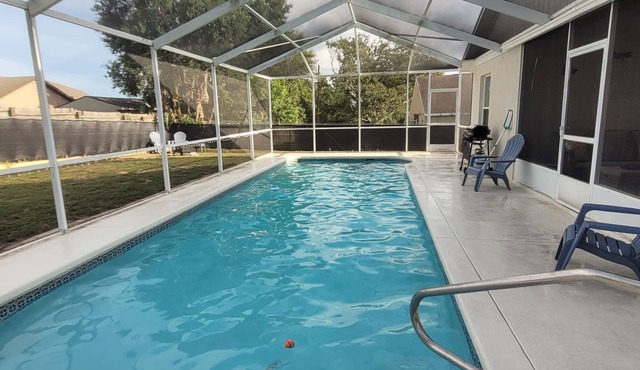 Relax in this remodeled home with screened 36-ft pool, patio & fire pit.
