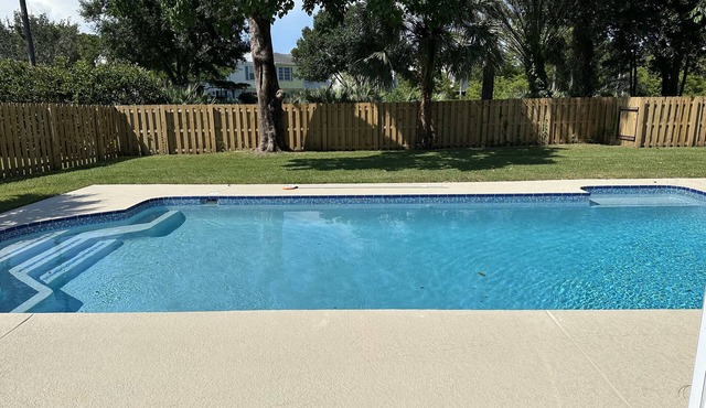 The Pink Flamingo rental with a large pool for relaxing in the sunshine