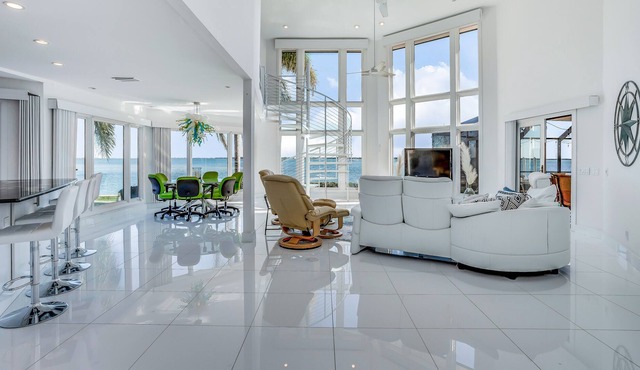 Waterfront stunner with ocean views, pool, hot tub, kayaks, dock, & luxe suites