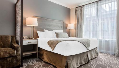 Two-Bedroom Suite with One King, Two Queen Beds, and Sofa Bed