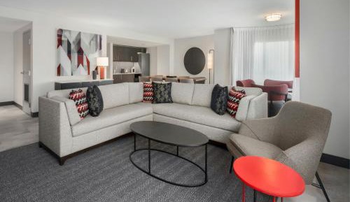 Larger One-Bedroom Presidential King Suite with Dining Area and Sofa Bed