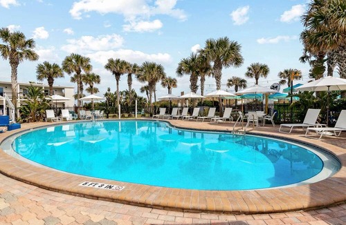 Neptune Beach Hotel | Explore Local Gems from a Relaxing Beachfront Room with Outdoor Swimming Pool
